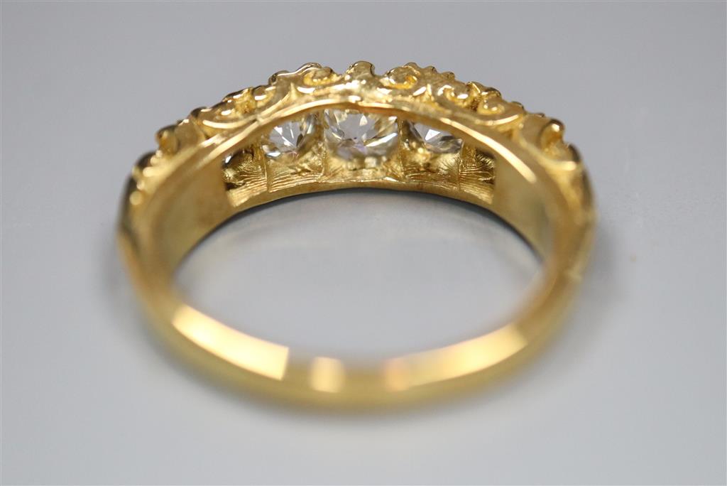A modern Victorian style 18ct gold and graduated old round cut diamond set half hoop ring,